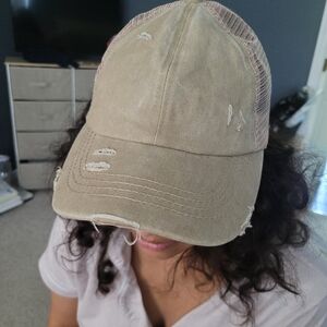 Distressed pony tail hat